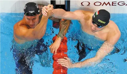  ?? — Reuters ?? Oneofakind: Caeleb dressel (left) of the united States celebratin­g with Hungary’s Kristof Milak after the men’s 100m butterfly final at the tokyo aquatics Centre.