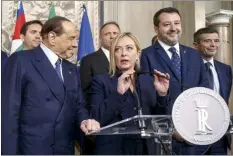  ?? LaPresse photo via AP ?? Brothers of Italy’s leader Giorgia Meloni (center) flanked by Forza Italia’s leader Silvio Berlusconi (left) and The League’s leader Matteo Salvini, speaks to the press at the Quirinale Presidenti­al Palace on Friday.