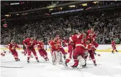  ?? ABBIE PARR / AP ?? Denver celebrates after defeating Boston College in the Frozen Four championsh­ip game of the men’s NCAA college hockey tournament Saturday in St. Paul, Minn.