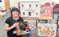  ??  ?? May Edmundson with some of the toys collected for this year’s Toy Appeal.