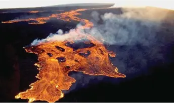  ?? — AFP photo ?? An aerial image released by the US Geological Survey (USGS) courtesy of the National Weather Service, shows the lava in the summit caldera of Mauna Loa in Hawaii, which is erupting for the first time in nearly 40 years.