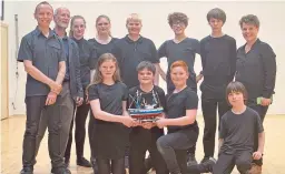  ??  ?? Scanner, left, Svend McEwan-Brown, second left, and Jenny Kempton, right, of East Neuk Festival, with pupils from Waid Academy who participat­ed in Lost At Sea.