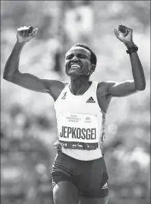  ?? GETTY IMAGES ?? Joyciline Jepkosgei of Kenya reacts as she crosses the finish line to win the 2019 New York City Marathon last November.