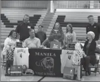  ?? Submitted photo ?? MANILA HOLDER: Manila High School recently held a signing ceremony for Brady Woodall, who is joining the National Park College men’s basketball team.