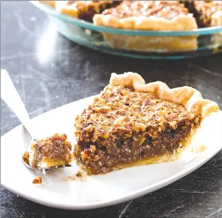  ?? Associated Press photo ?? This undated photo provided by America’s Test Kitchen shows classic pecan pie in Brookline, Mass.