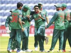  ?? — AP ?? CARDIFF: This is a Friday June 9, 2017 file photo of Bangladesh’s Mosaddek Hossain, center, as he celebrates with his teammates after taking the wicket of New Zealand’s James Neesham during the ICC Champions Trophy, Group A cricket match between New...