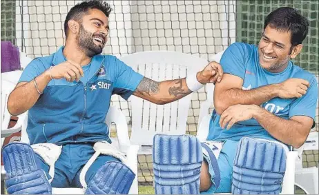  ?? AFP PHOTO ?? Virat Kohli (left) and MS Dhoni are alleged to have interests in player management firms that managed accounts of India players.