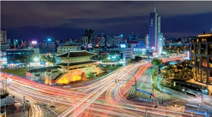  ??  ?? This page from
top: Dongdaemun at night; Seoul Station 7017 Project; and Figure Museum W