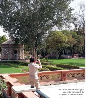  ??  ?? The castle’s substantia­l courtyard and, in the background, its temple dedicated to Lord Shiva.