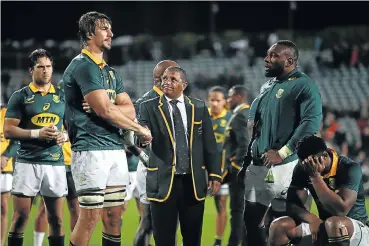  ?? Picture: Getty Images ?? Springbok coach Allister Coetzee, middle, shakes hands with captain Eben Etzebeth after the 57-0 defeat in the Rugby Championsh­ip against the All Blacks at QBE Stadium in Albany in September. Jan Serfontein, left, and Tendai Mtawarira look on.