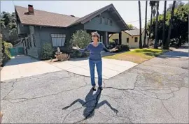  ?? Mel Melcon Los Angeles Times ?? YOLANDE TREUSCORFF of Pasadena stands on a stretch of Pasadena Avenue where the homes are owned by Caltrans in August 2015.