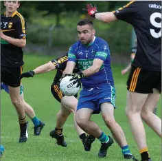  ??  ?? AGB’s Niall Higgins looks like he is ready to go through a wall for his team in the JBFC clash with Avoca in Pearse’s Park.