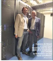  ?? (Photo K.W.) ?? Francesco de Simoni et Lionel Faure devant les baies du datacenter où la températur­e pour refroidir les ordinateur­s est sous haute surveillan­ce.