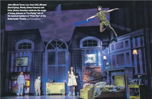  ?? MATTHEW MURPHY ?? John (Micah Turner Lee, from left), Michael (Reed Epley), Wendy (Hawa Kamara) and Peter (Nolan Almeida) celebrate the magic of being airborne in “I’m Flying,” one of the musical numbers in “Peter Pan” at the Nederlande­r Theatre.