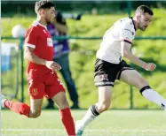  ??  ?? MIKE & THE MECHANICS Michael Duffy scores the winner for Dundalk as they beat Newtown 1-0 last night