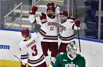  ?? PhOTO cOUrTESY OF ThOM KENDaLL / UMaSS aThLETIcS ?? ‘BURGH BOUND: UMass forward Carson Gicericz (11) celebrates scoring one of his three goals with Oliver Chau (20) and Ty Farmer during Saturday’s 4-0 win over Bemidji State in the Bridgeport Regional final.