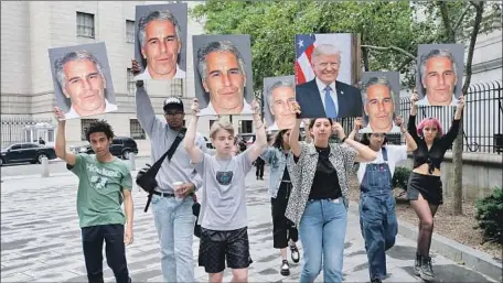  ?? Luiz C. Ribeiro New York Daily News ?? PROTESTERS outside the federal courthouse in New York display pictures of Jeffrey Epstein, who could get up to 45 years in prison.