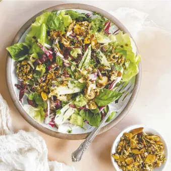  ?? PHOTOS: MICAH SIVA ?? Micah Siva's salad is a vibrant side for Passover, with fresh herbs, a tangy dressing and an addictive almond crunch topping. The recipe is featured in her plant-based cookbook, Nosh.
