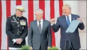  ??  ?? Donald Trump with the joint chiefs chairman Joseph Dunford (left) and defence secretary Jim Mattis at a Memorial Day ceremony.