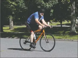  ?? The Sentinel-Record/Richard Rasmussen ?? BACK ON BIKES: An unidentifi­ed man rides a bike on Whittingto­n Avenue Thursday. The increase in the number of bikers all over the country has been significan­t, and Garland County is no different.