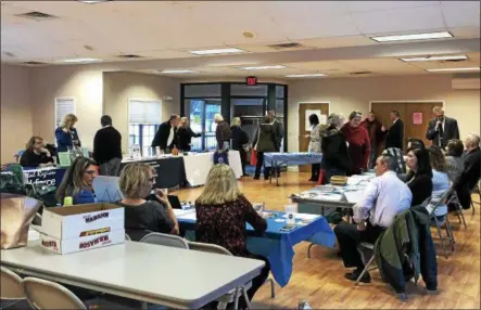  ?? NICHOLAS BUONANNO — NBUONANNO@TROYRECORD.COM ?? Residents talk with different Rensselaer County department officials Tuesday night in Brunswick for the first RensCo on the Road event hosted by the county executive’s office.