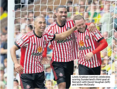  ??  ?? Lewis Grabban (centre) celebrates scoring Sunderland’s third goal at Norwich with David Vaughan (left) and Aiden McGeady