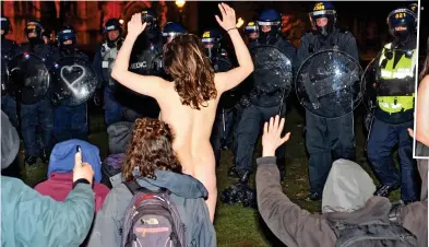  ??  ?? Clash: A female demonstrat­or strips off as police clear a protest camp early yesterday