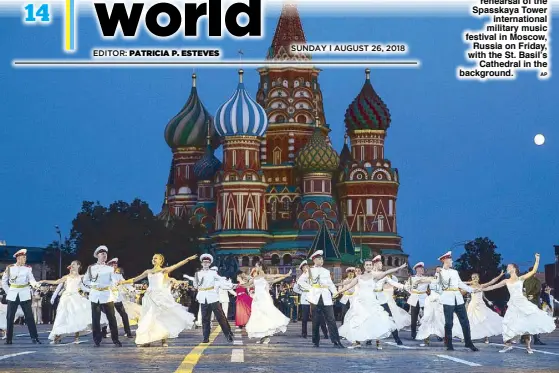  ?? AP ?? Russian military band participan­ts perform during a rehearsal of the Spasskaya Tower internatio­nal military music festival in Moscow, Russia on Friday, with the St. Basil’s Cathedral in the background.