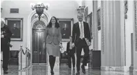  ?? LAURA DOVE ?? Laura Dove, who will become the top lobbyist for Ford in Washington, D.C., in January, walks with Robert Duncan, rho succeeded Dove as aide to Sen. Mitch McConnell.