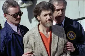  ?? (AP/John Youngbear) ?? Theodore “Ted” Kaczynski is flanked by federal agents as he is led to a car from the federal courthouse in Helena, Mont., in April 1996.