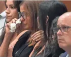  ?? ?? Patricia Padauy Oliver is comforted as a witness testifies to her son’s fatal injuries during the penalty phase of the trial of the Marjory Stoneman Douglas High School shooter at the Broward County Courthouse in Fort Lauderdale on Aug. 1, 2022.