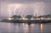  ?? SHMUEL THALER — SANTA CRUZ SENTINEL ?? A rare lightning storm crackles over Mitchell’s Cove in Santa Cruz around 3 a.m. on Aug. 16, 2020.