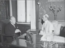  ?? LUIGI FELICI — THE ASSOCIATED PRESS FILE ?? President Truman's envoy to the Vatican, Myron C. Taylor, left, has an audience with Pope Pius XII at Castelgand­olfo near Rome, on Aug. 26, 1947. The Vatican has long defended its World War II-era pope, Pius XII, against criticism that he remained silent as the Holocaust unfolded, insisting that he worked quietly behind the scenes to save lives.