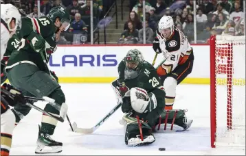  ?? STACY BENGS — THE ASSOCIATED PRESS ?? Minnesota goaltender Marc-Andre Fleury (29) blocks the puck from getting to the Ducks’ Isac Lundestrom (21).