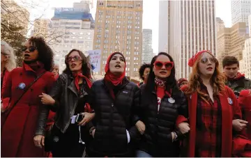  ?? (Reuters) ?? ORGANIZERS LINDA SARSOUR (center), Carmen Perez and Bob Bland lead during a ‘Day Without a Woman’ march on Internatio­nal Women’s Day in New York, on March 8th.