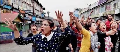  ?? PTI ?? GJM supporters during a rally in Darjeeling on Sunday. Dozens of policemen were injured in clashes with protesters, as unrest worsens in the hill resort at the height of the tourist season. —