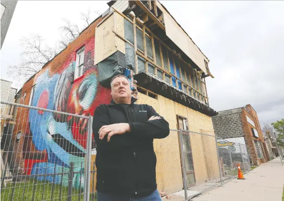  ?? DAN JANISSE ?? Randy Diestelman­n stands in front of the Drouillard Avenue building he is renovating. He has applied to a city program that offers building improvemen­t incentives.