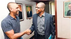  ?? CONTRIBUTE­D ?? Vice-president and General Manager of Xoom Julian King (left) is greeted by President and Chief Executive Officer of the Victoria Mutual Group Courtney Campbell. King visited Victoria Mutual’s Half-Way Tree corporate office recently.
