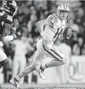  ?? Jonathan Bachman / Getty Images ?? Max Johnson stunned A&M in his last game at LSU on a 28-yard touchdown pass in the final minute.