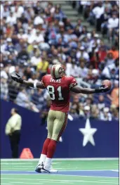  ?? VERN STEINMAN — THE ASSOCIATED PRESS ?? 49ers wide receiver Terrell Owens celebrates a touchdown catch against the Dallas Cowboys during a 2000game in Irving, Texas. The game was played in September that year and the teams have not played each other on Thanksgivi­ng since 1972.