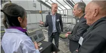  ??  ?? Biolumic researcher Lulu He, left, and chief executive Warren Bebb, centre, take Sprout summit attendees on a tour of the new research and developmen­t centre.