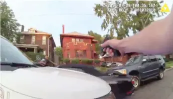  ?? | CHICAGO POLICE DEPARTMENT/ IPRA ?? In this screengrab from bodycam video provided by the Independen­t Police Review Authority, police officers fire into a stolen car driven by Paul O’Neal on July 28.