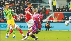  ??  ?? HERE WE GO: West Brom’s Callum Robinson scores their first goal