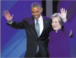  ?? J. SCOTT APPLEWHITE/ THE ASSOCIATED PRESS ?? President Barack Obama and Democratic presidenti­al nominee Hillary Clinton wave to delegates July 27 after the president’s speech at the Democratic National Convention in Philadelph­ia. Obama has said, “I will consider it a personal insult, an insult to my legacy,” if African-American voters don’t turn out for Clinton the way they did for him.