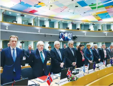  ?? (Francois Lenoir/Reuters) ?? NORWEGIAN FOREIGN MINISTER Borge Brende (left), British Foreign Secretary Boris Johnson (second left) and other diplomats observe a minute of silence for the victims of the Syrian attack yesterday during a conference in Brussels.