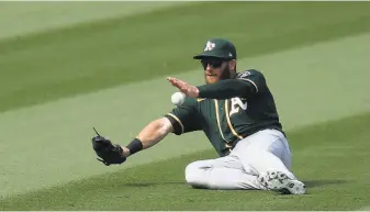  ?? Harry How / Getty Images ?? Robbie Grossman led the A’s in onbaseplus­slugging percentage (. 826). The switchhitt­ing outfielder hit eight homers in 51 games after totaling 11 in the previous two seasons combined.