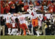  ?? JOHN BAZEMORE - THE ASSOCIATED PRESS ?? FILE - In this Jan. 10, 2017, file photo, Clemson’s Deshaun Watson celebrates a last second game-winning touchdown pass to Hunter Renfrow in the second half of the NCAA college football playoff championsh­ip game against Alabama in Tampa, Fla.