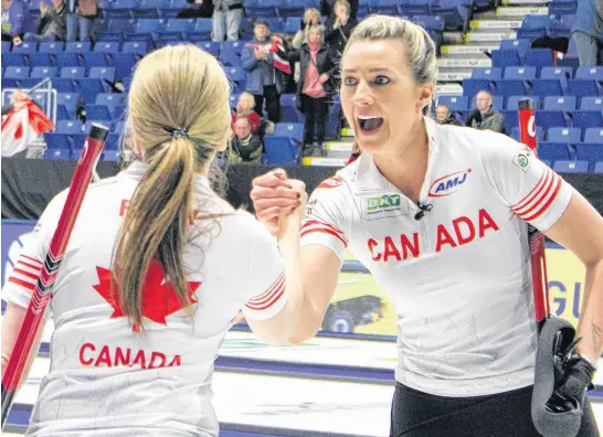  ?? LUKE DYMENT • SALTWIRE ?? Team Canada teammates Tracy Fleury, left, and Emma Miskew celebrate after defeating Italy 8-7 at the World Women’s Curling Championsh­ip at Centre 200 in Sydney on Tuesday. In what was a battle between two undefeated teams, the game required an extra end to be decided.