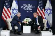  ?? EVAN VUCCI - THE ASSOCIATED PRESS ?? President Donald Trump shakes hands with Israeli Prime Minister Benjamin Netanyahu during a meeting at the World Economic Forum, Thursday, Jan. 25, 2018, in Davos.