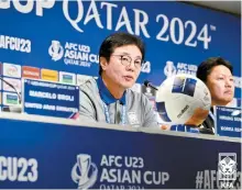  ?? Courtesy of the Korea Football Associatio­n ?? Hwang Sun-hong, left, head coach of Korea speaks during a media conference at the AFC U-23 Asian Cup football tournament in Doha, Qatar, April 15.